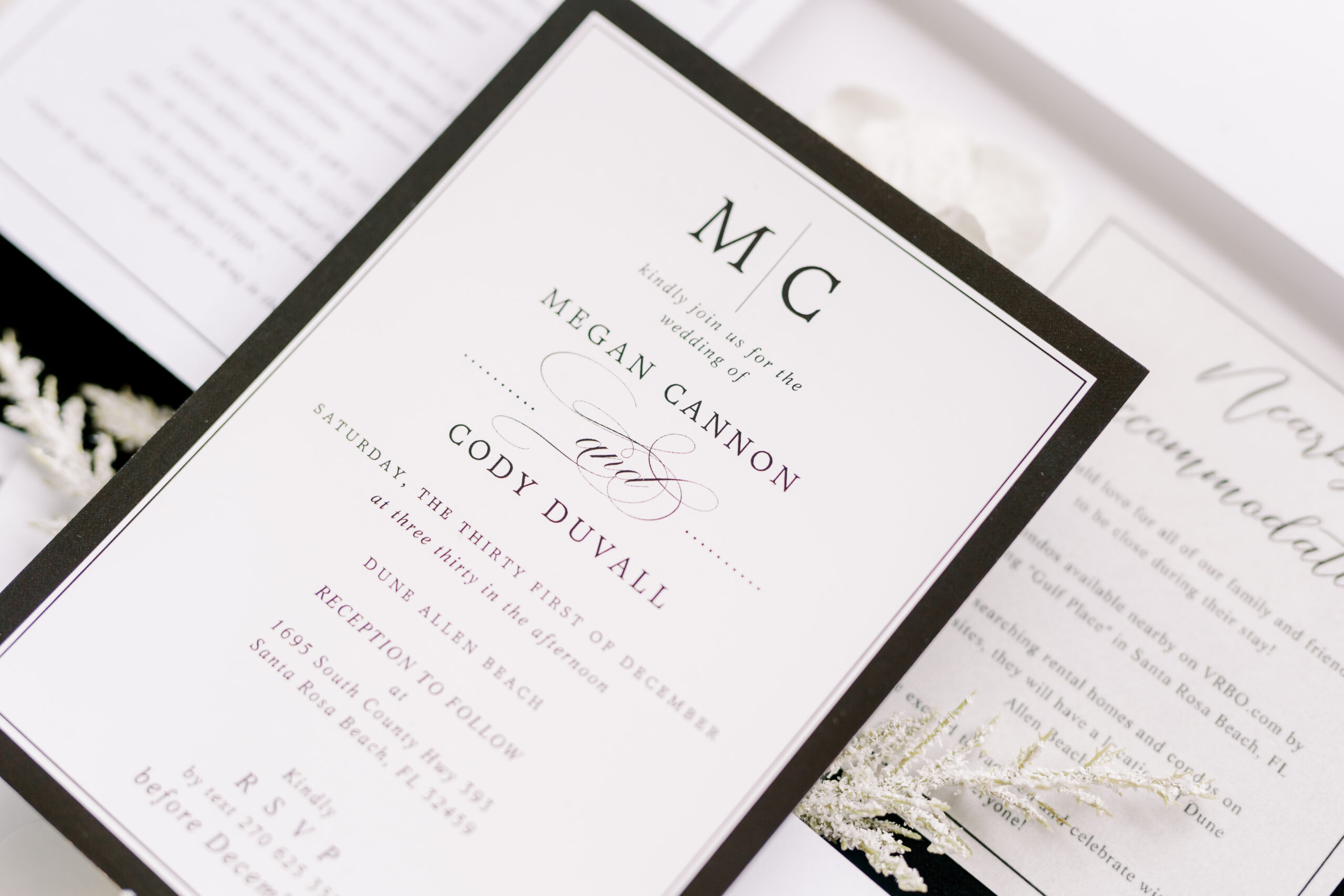 upclose shot of the wedding invitations for a modern black and white wedding