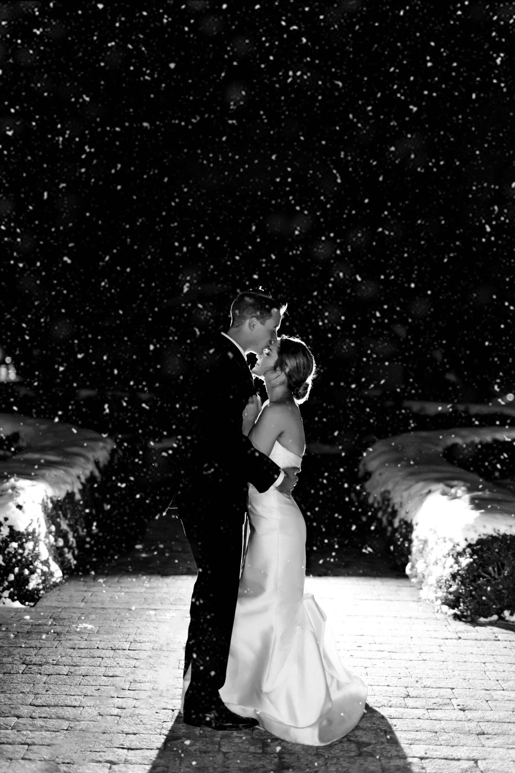 bride and groom nightime portrait in the snow