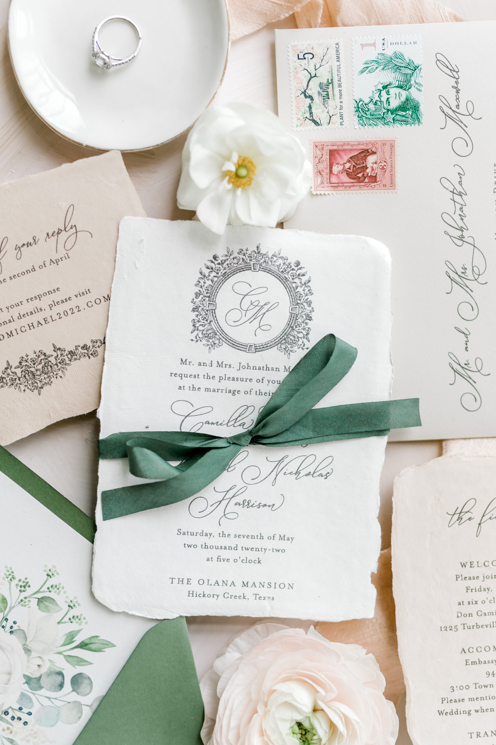 wedding invitation tied with green ribbon