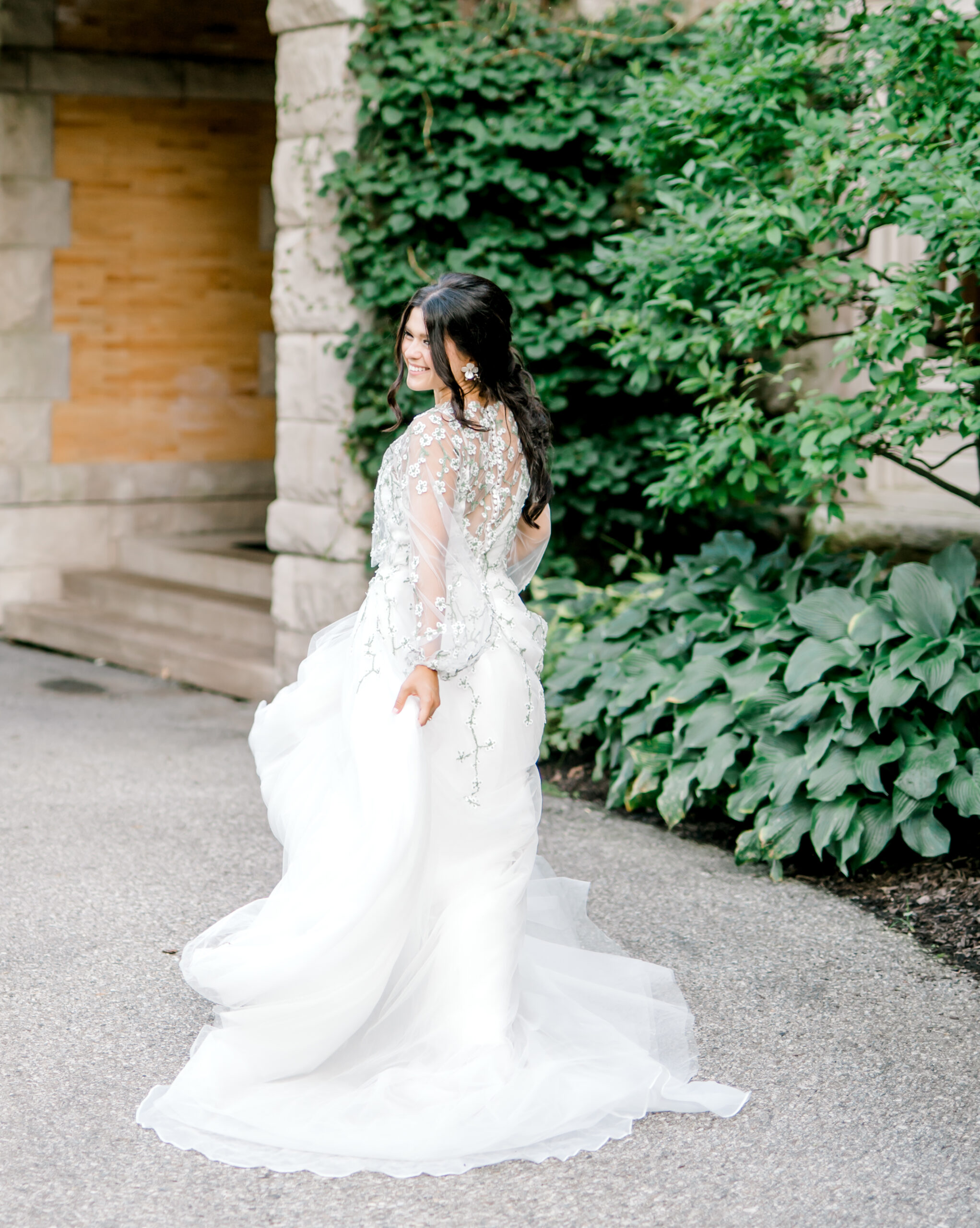 bride runs away into venue holding on to her wedding dress