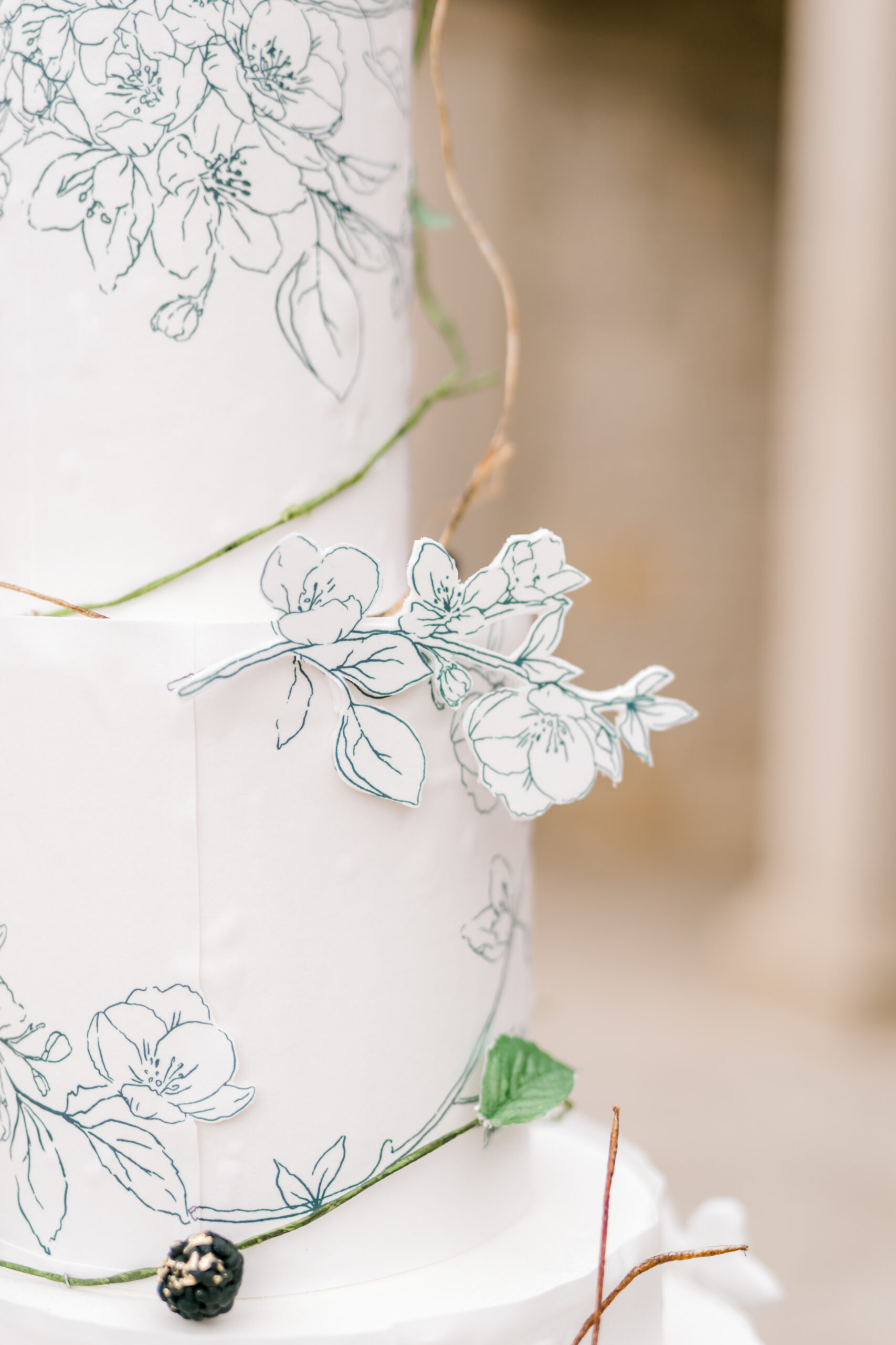 wedding cake with white and green fine line florals